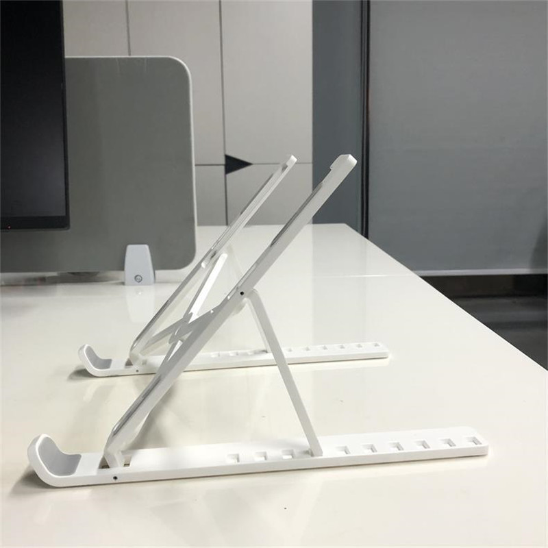 white 100piece Laptop stand folding vertical plastic portable lifting desktop cooling base bracket