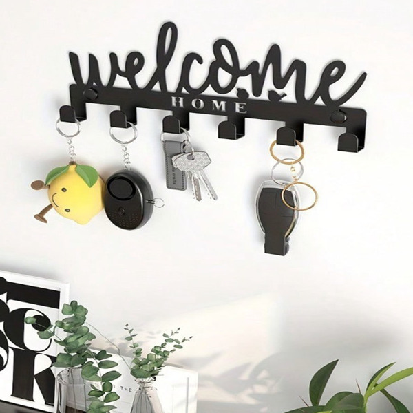This one - piece adhesive - mounted key holder doubles as an all - in - one organizer. It can hold keys, hats, and towels, offering a sleek and practical solution for wall - mounted storage.-1
